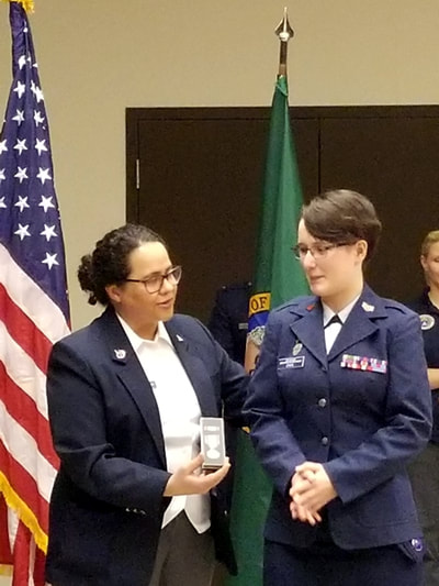 Cadet Chick pictured here in Dec. 2017 with Tiffany McRae presenting a DAR Outstanding Cadet Award